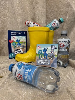 Gerolsteiner - zehn Dino-Pakete: ein Dino-Puzzle, ein Mini-Buch, ein Schoko-Nikolaus sowie drei Sixpacks Mineralwassers