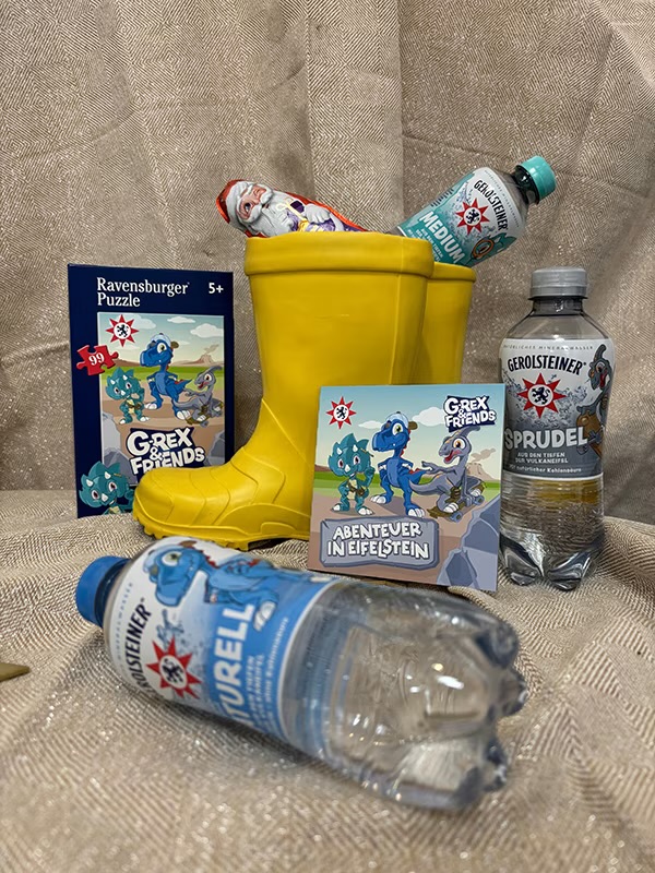 Gerolsteiner - zehn Dino-Pakete: ein Dino-Puzzle, ein Mini-Buch, ein Schoko-Nikolaus sowie drei Sixpacks  Mineralwassers