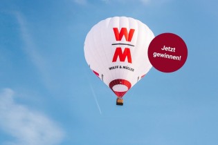 WOLFF & MÜLLER - Ein Gutschein für eine Ballonfahrt im W&M Heißluftballon für zwei Personen im Raum Stuttgart, W&M Socken und Baustellenkinderbuch W&M Honig, Bienenwachstuch,W&M Mini-Zollstöcke