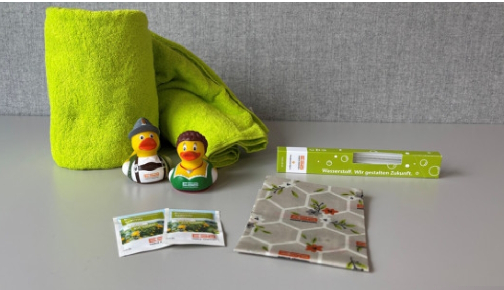 ESB Energie Südbayern - 3x Badetuch+Badeenten im ESB-Branding, 7x Set Blumensamen+Bienenwachstüchern, 10x Glashalme